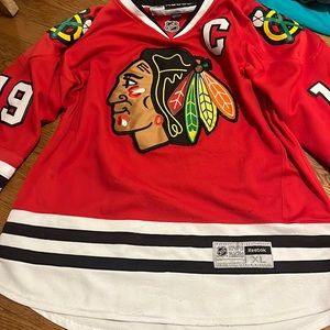 Toews blackhawks jersey. Number 19, Reebok brand.